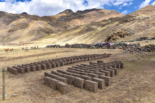 Adobe mud bricks drying in the sun. Chillca, Cusco, Peru photo