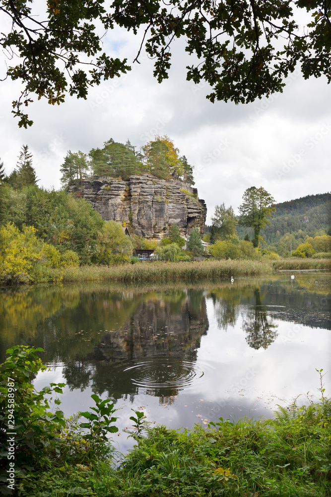 Impregnable medieval rock castle Sloup from the 13th century with Castle pond in northern Bohemia, Czech Republic