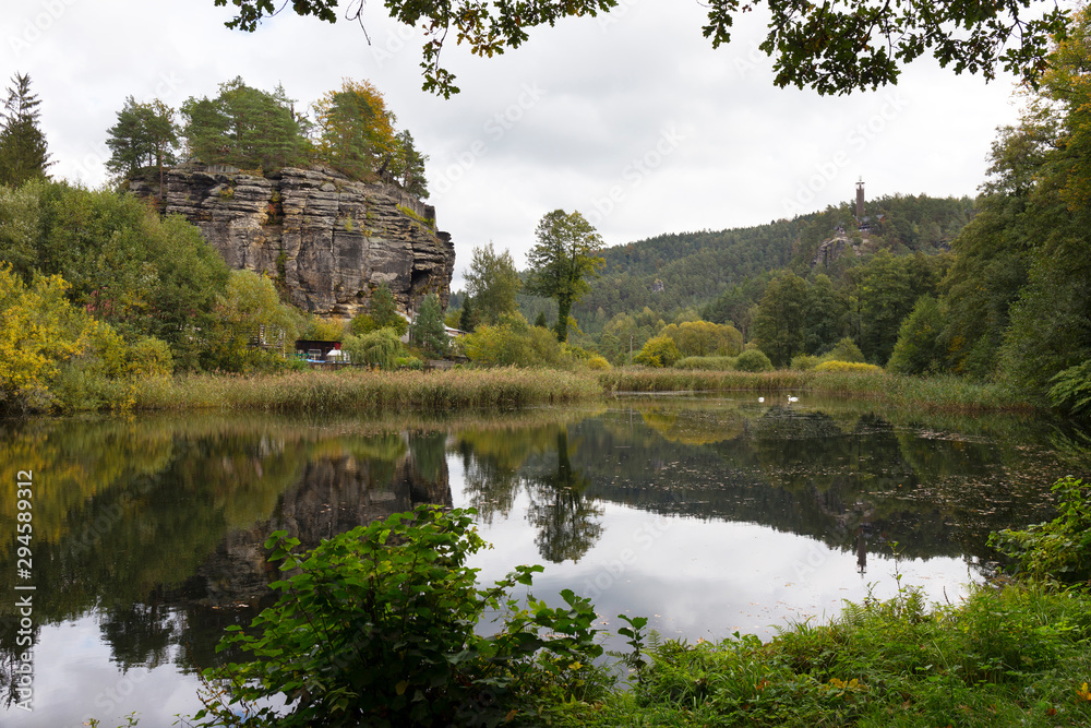 Impregnable medieval rock castle Sloup from the 13th century with Castle pond in northern Bohemia, Czech Republic