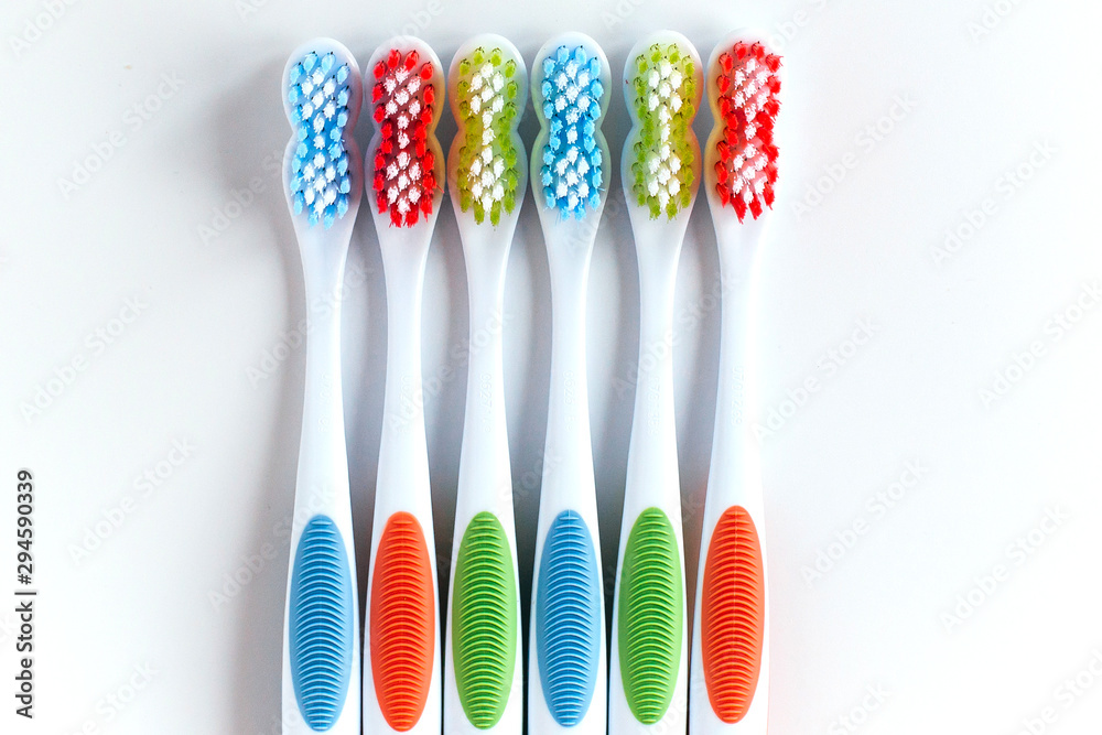 six multi-colored toothbrushes on a white background 1 six multi-colored toothbrushes on a white background 1