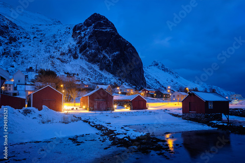 Ramberg village with red traditional rorbue houses in the night, Norway photo