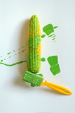 Corn is painted with paintbrush on white background.idea food concept
