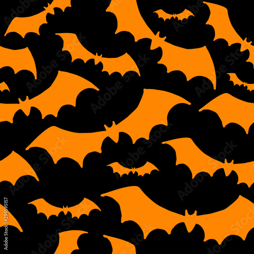 Halloween background. Orange silhouettes of bats on black background. Seamless vector pattern