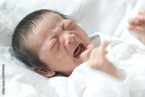 Closeup newborn baby is crying and screaming : Soft focus 