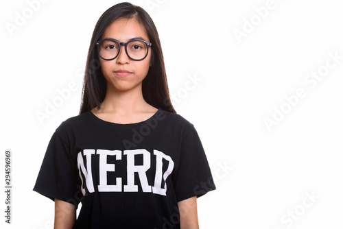 Studio shot of young Asian teenage nerd girl