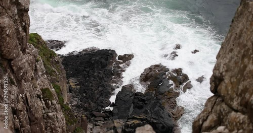 Waves breaking on coastal cliffs of Scotland.