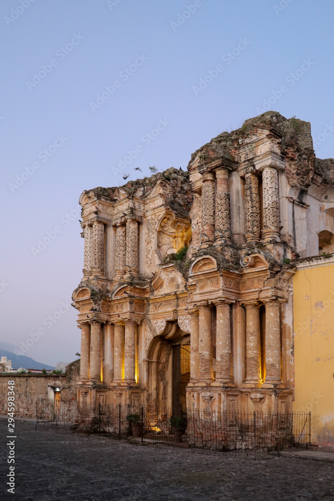 Fototapeta premium Gorgeous Guatemala - Day and night walking tour around the streets of UNESCO world heritage site Antigua - beautiful scenery, old buildings, preservation, sunrise, sunset, dusk, bright colours