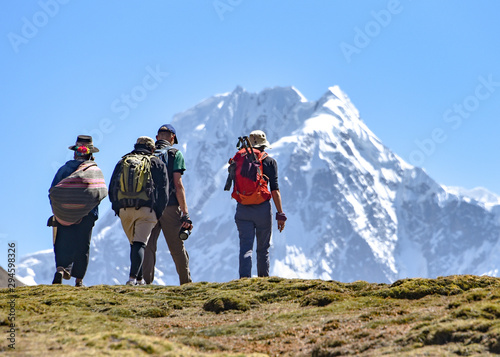 A group of trekkers on the Ausungate trail in the Peruvian Andes photo