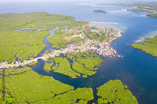 Town on the water and mangroves, top view. Coast of the island of Siargao. Tropical landscape. © Tatiana Nurieva