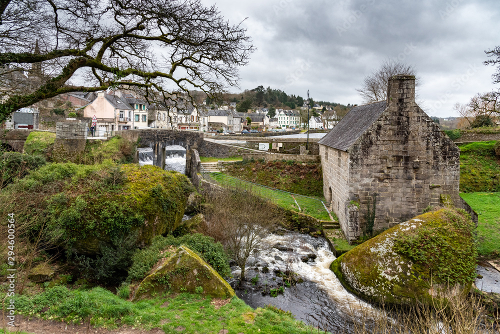 The Huelgoat, a small town in Brittany, in the heart of the Regional Natural Park of Armorique. An old mill is located at the foot of the lake dam.