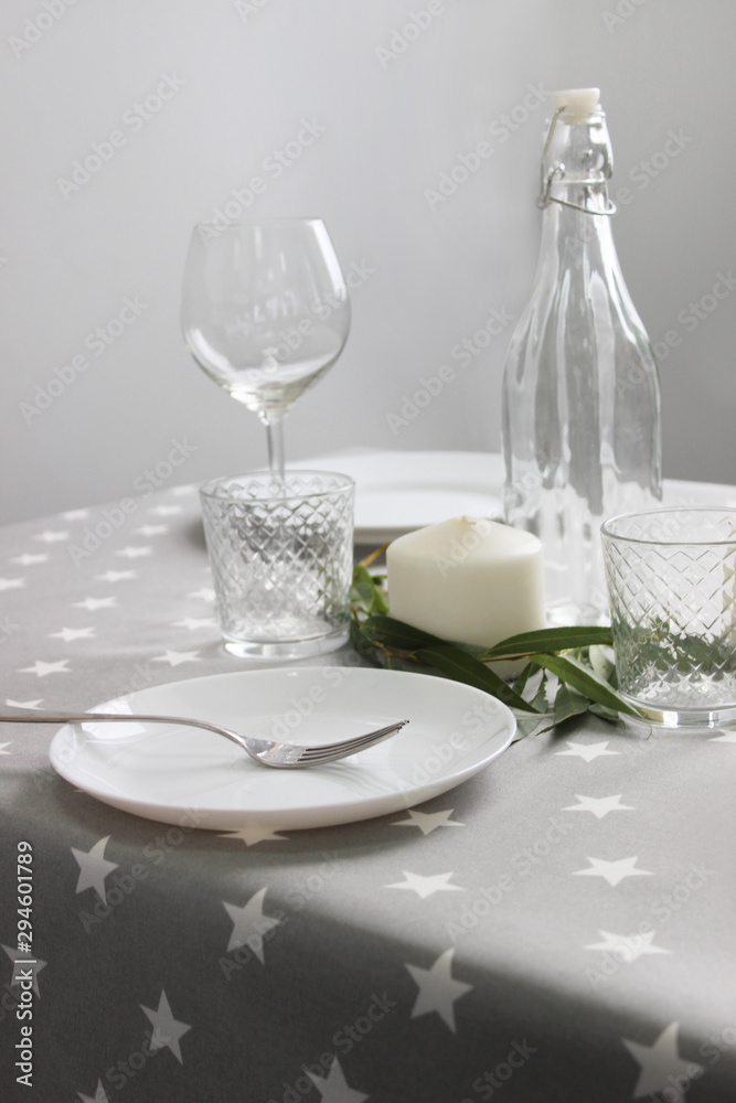 on the table plate and glasses, table setting close-up in the interior. on the table plate and glasses, table setting close-up in the interior.