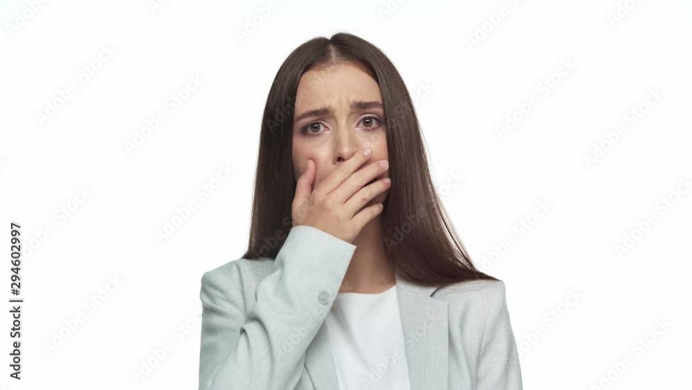 frustrated businesswoman covering mouth isolated on white frustrated businesswoman covering mouth isolated on white