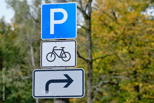 Traffic signs informing about a parking space for bicycles on the right side in October in Germany