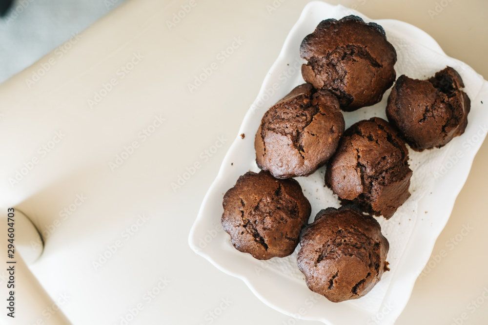 Chocolate homemade cupcakes muffins. in white plate Chocolate homemade cupcakes muffins. in white plate