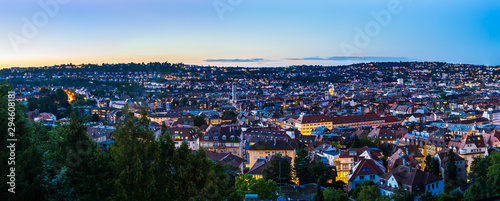 Obraz na płótnie Germany, XXL panorama of sunset sky over urban cityscape of stuttgart city houses and roofs, aerial view from above over illuminated skyline in summertime w salonie
