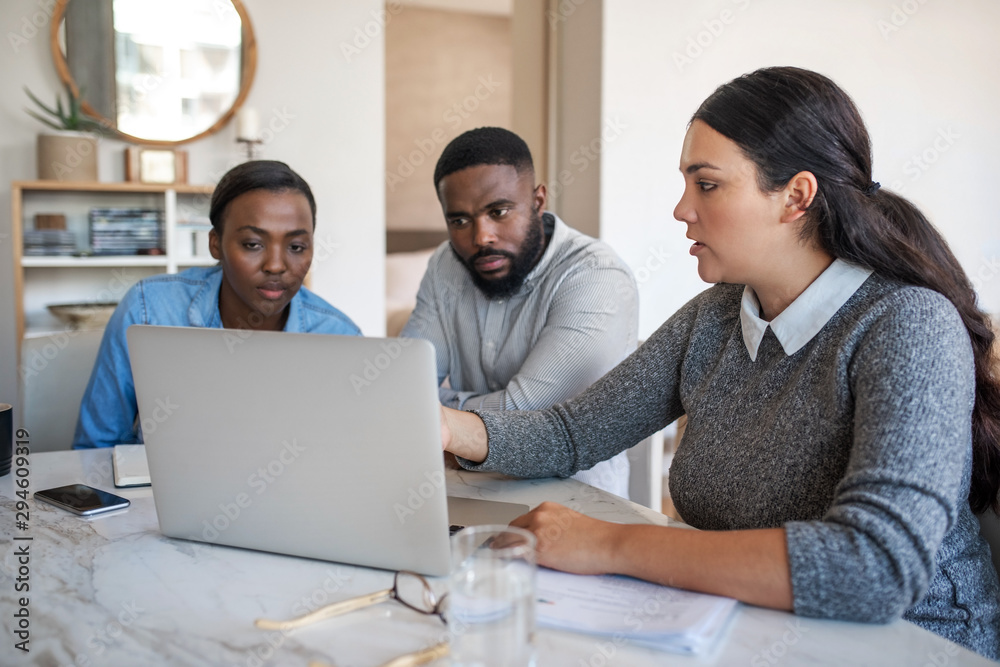 Financial planner talking with an African American couple at home Financial planner talking with an African American couple at home