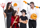 Front view family dressed in halloween costumes