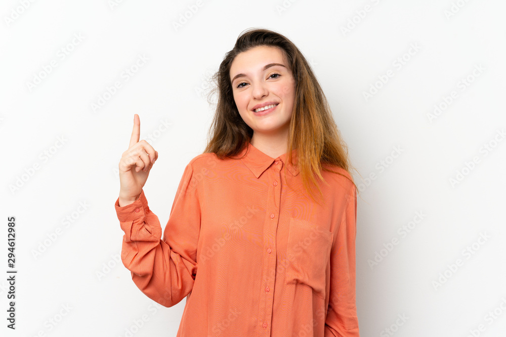 Young brunette girl over isolated white background showing and lifting a finger in sign of the best Young brunette girl over isolated white background showing and lifting a finger in sign of the best