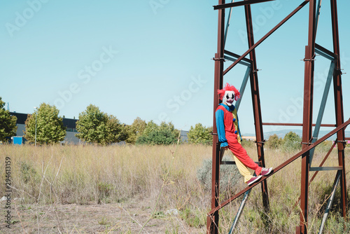 scary clown on an abandoned billboard.