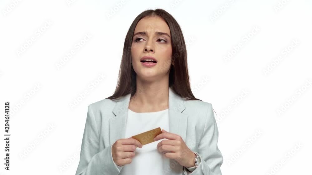 pensive businesswoman holding credit card isolated on white pensive businesswoman holding credit card isolated on white