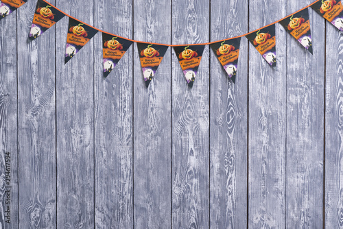 Halloween garland on wooden background photo