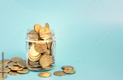 Glass jar for tips with money isolated