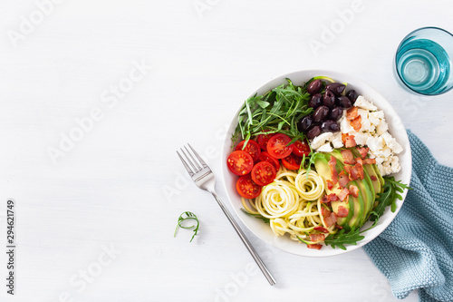 ketogenic lunch bowl: spiralized courgette with avocado, tomato, feta cheese, olives, bacon photo