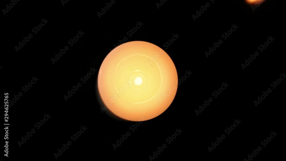 Candle being lit by a wooden match stick. Candle flame close up while lighting a fire by a match. Candle light close up. Candle being lit by a wooden match stick. Candle flame close up while lighting a fire by a match. Candle light close up.