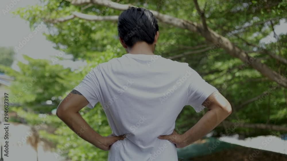 Rear View Of man Touching Back In backache Rear View Of man Touching Back In backache