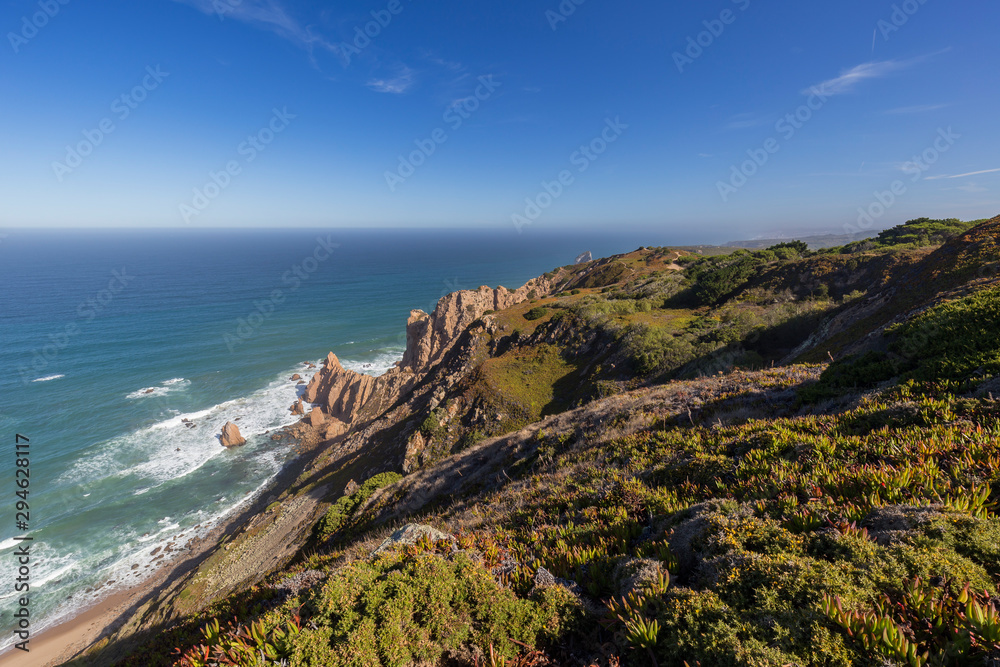Scenic view of the Atlantic Ocean and rugged coast near Cabo da Roca, the westernmost point of mainland Europe, in Portugal.