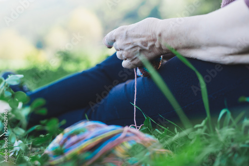 Woman knitting outdoors