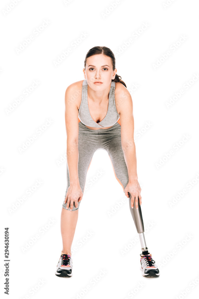 front view of disabled sportswoman with prosthetic leg isolated on white front view of disabled sportswoman with prosthetic leg isolated on white