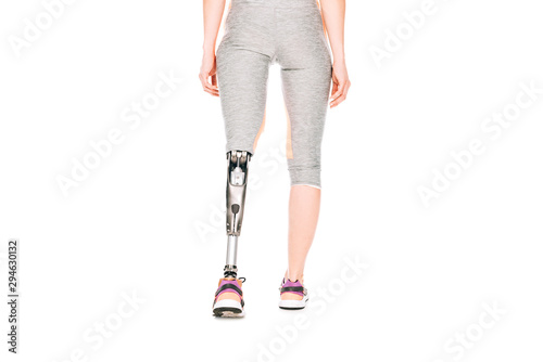 partial view of disabled sportswoman with prosthetic leg isolated on white