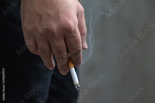 Image of man smoking cigarettes.