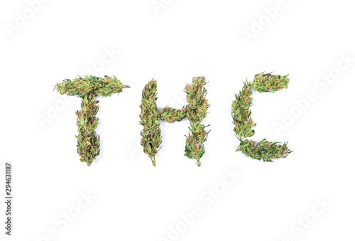 Top view of sign THC made of fresh green marijuana flowers or buds isolated on white background. Alternative treatment. Medical cannabis.