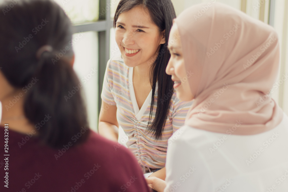 A group of women talked and presented ideas during the meeting. - obrazy, fototapety, plakaty 