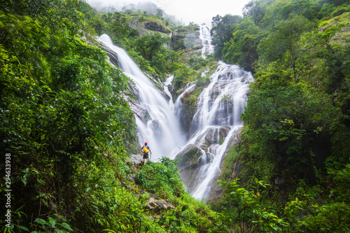 The man touring on Pi-tu-gro waterfall, Beautiful waterfall in Tak province, ThaiLand.