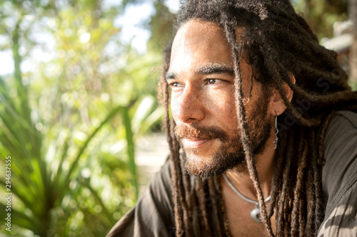 handsome guy with dreadlocks on an island in thailand photo