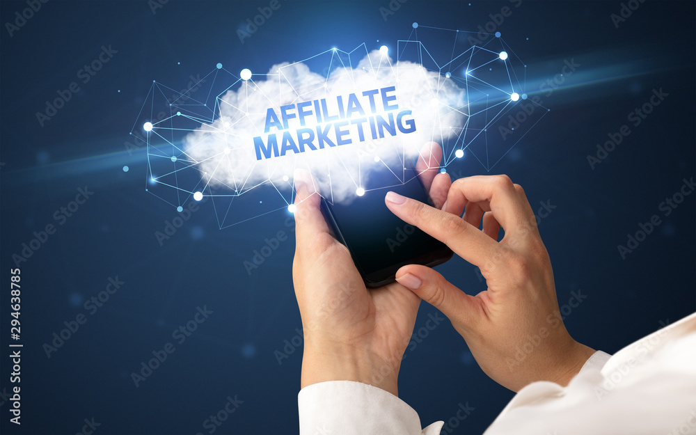 Female hand touching smartphone with AFFILIATE MARKETING inscription, cloud business concept Female hand touching smartphone with AFFILIATE MARKETING inscription, cloud business concept