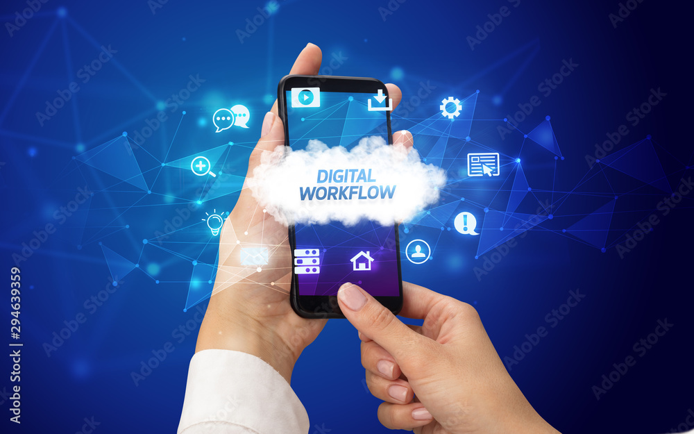 Female hand holding smartphone with DIGITAL WORKFLOW inscription, cloud technology concept Female hand holding smartphone with DIGITAL WORKFLOW inscription, cloud technology concept