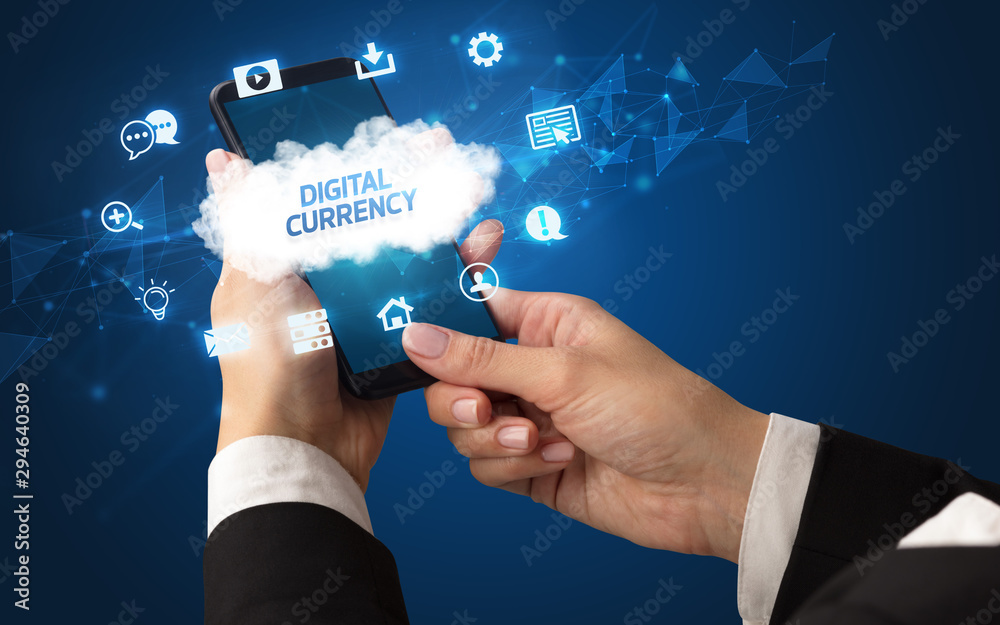 Female hand holding smartphone with DIGITAL CURRENCY inscription, cloud technology concept