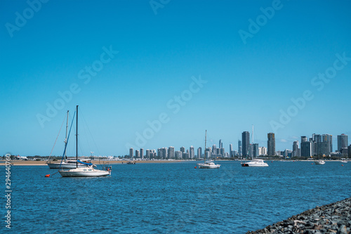 Beautiful view of white yachts and fishing boats cruising the stunning Broadwater, the Gold Coast's premier waterfront in Australia.