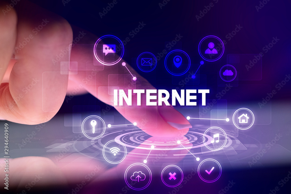 Finger touching tablet with web technology icons and INTERNET inscription, web technology concept Finger touching tablet with web technology icons and INTERNET inscription, web technology concept