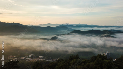 Aerial view from drone beautiful mist over forest and village © thexfilephoto
