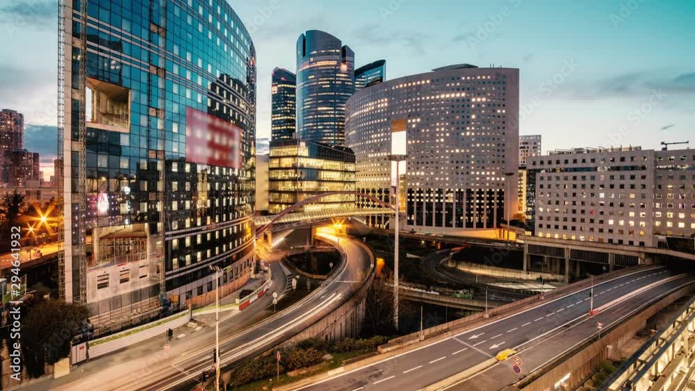 Loop Time lapse video of Paris overlooking the light trails of passing cars in the La Defense business district.