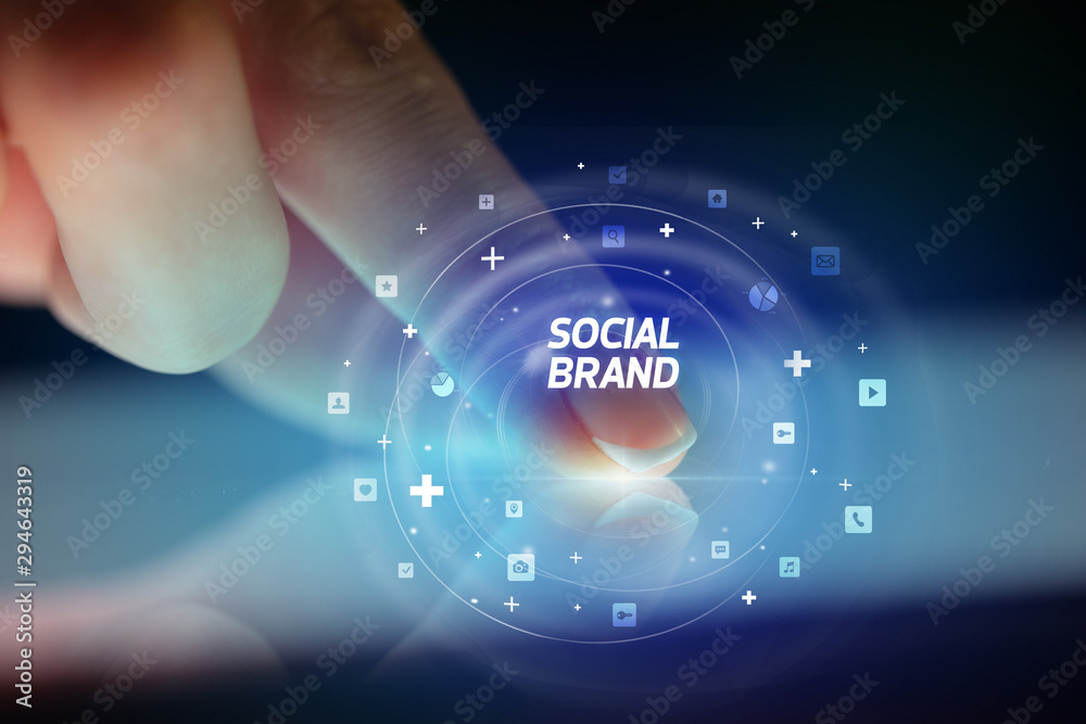 Finger touching tablet with social media icons and SOCIAL BRAND Finger touching tablet with social media icons and SOCIAL BRAND