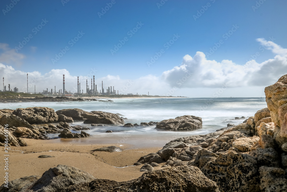 Landscape of Leça da Palmeira beach in Matosinhos, Porto. With the refinery in the background.