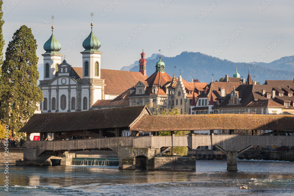 Jesuit church and Spreuer Bridge next to the Reuss rivet in Luzern or Lucerne, Switzerland landmark