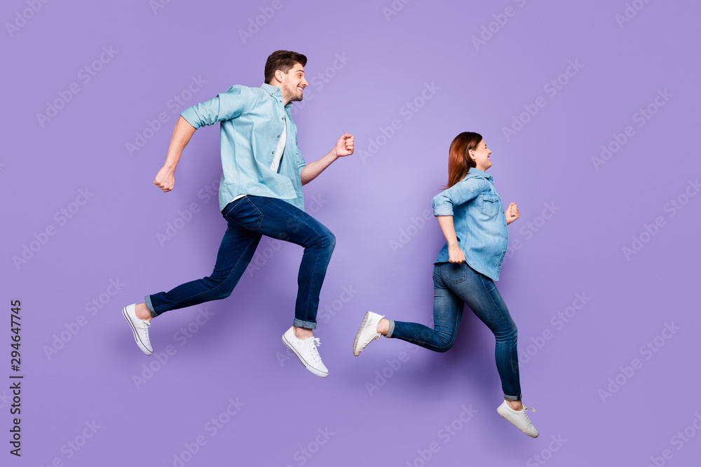 Full size photo of funny funky spouses brown hair redhair people jump run after discount wear modern clothes white sneakers isolated over violet purple color background