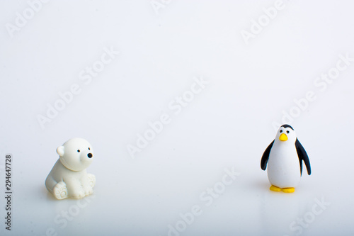 Penguin and polar bear rubber toys  cute animal shaped rubber doll isolated in white background. 